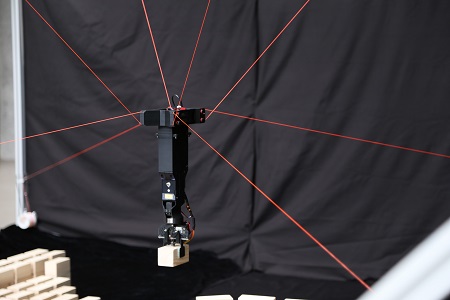  
		Figure 1: Cable-driven robot where multiple cables (in red) actuate the robot’s end-effector	 
